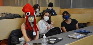 Students with hats and computers