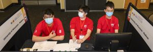 Three teams members at the competition
