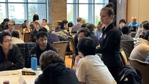 Lindsay Kamnetz talks to table of students