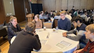 Rebecca Johnson talks to table of students