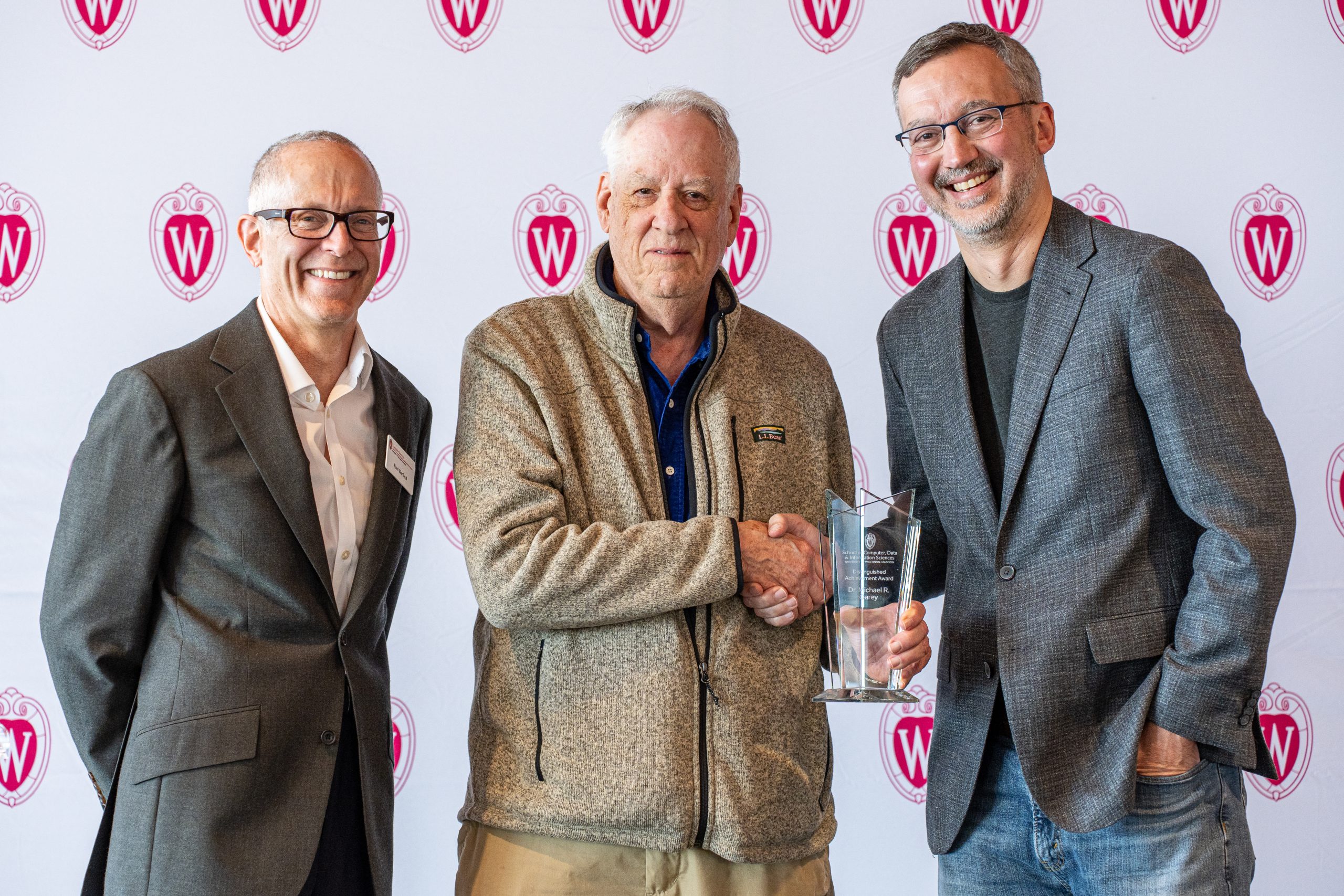 Computer Sciences Chair Paul Barford, alumnus Michael Garey, and Professor Remzi Arpaci-Dusseau pose as Garey receives the 2026 Distinguished Achievement Award.