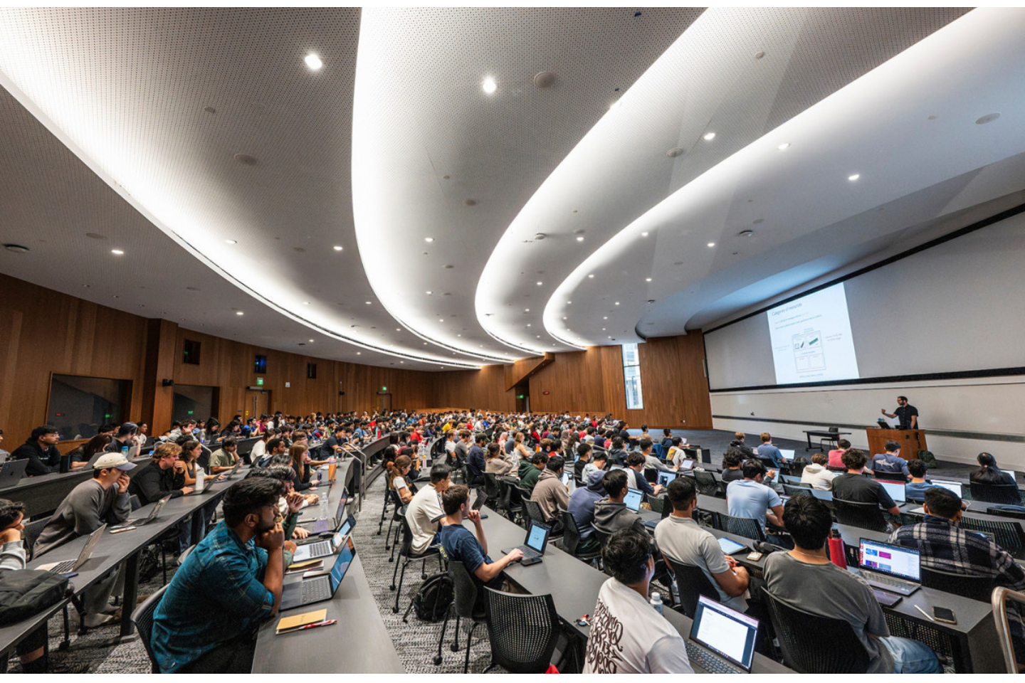 Students listen to a lecture in the Hello World classroom. 