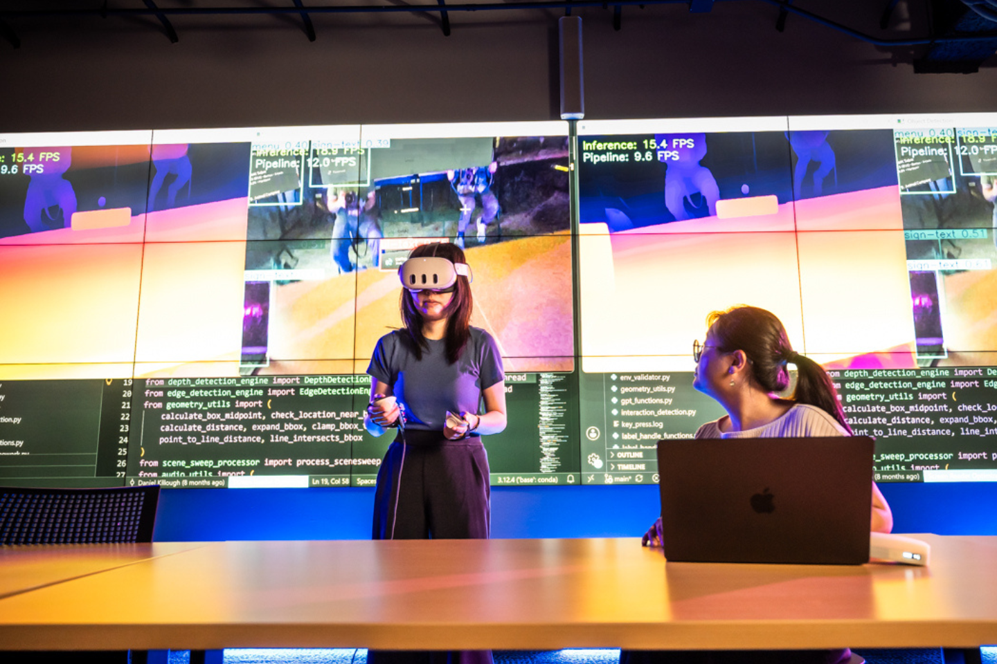 Yuhang Zhao with a student wearing visual reality headset